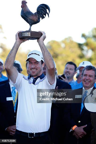 Nick Taylor of Canada is presented with the trophy after winning the Final Round of the Sanderson Farms Championship at The Country Club of Jackson...