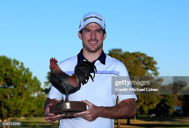 Nick Taylor of Canada is presented with the trophy after winning the Final Round of the Sanderson Farms Championship at The Country Club of Jackson...