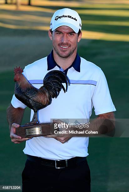 Nick Taylor of Canada is presented with the trophy after winning the Final Round of the Sanderson Farms Championship at The Country Club of Jackson...
