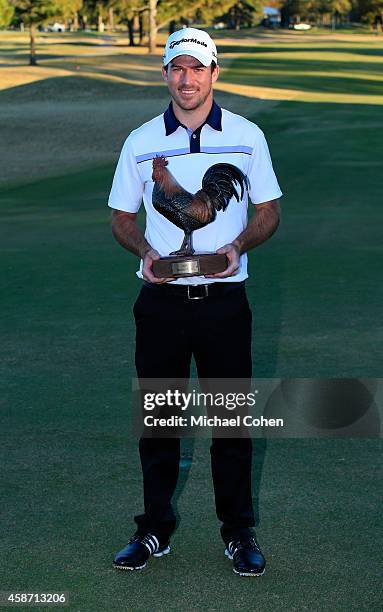 Nick Taylor of Canada is presented with the trophy after winning the Final Round of the Sanderson Farms Championship at The Country Club of Jackson...