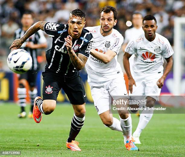Guerrero of Corinthians and Edu Dracena of Santoa in action during the match between Corinthians and Santos for the Brazilian Series A 2014 at Arena...