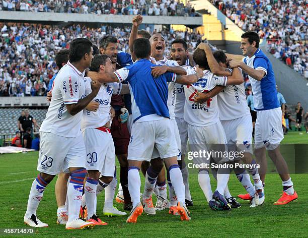 Sebastian Fernandez of Nacional and his teammates celebrate the first scored goal by Sebastian Fernandez during a match between Nacional and Peñarol...