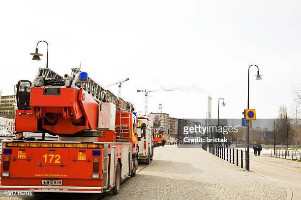fire engine on a quay in stockholm. - fire truck stock pictures, royalty-free photos & images