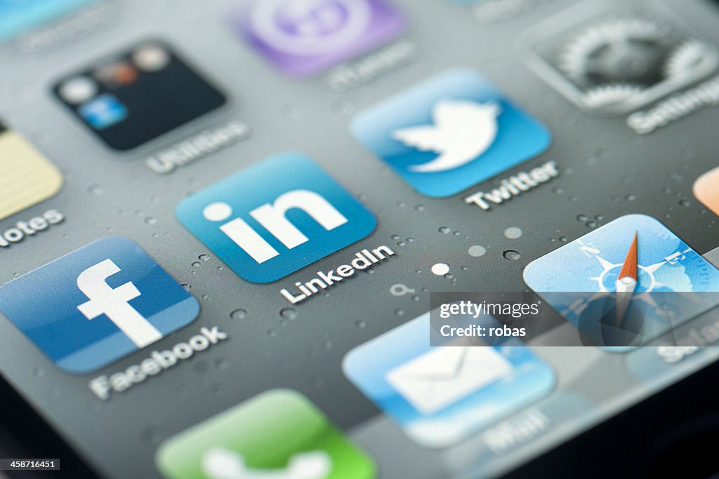 Three social media icons on iPhone screen