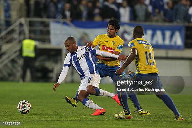Estoril's defender Anderson Luis tackles Porto's midfielder Yacine Brahimi during the Portuguese First League match between GD Estoril Praia and FC...