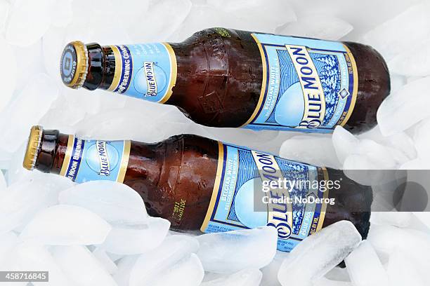 blue moon beer on ice - blue moon beer stock pictures, royalty-free photos & images
