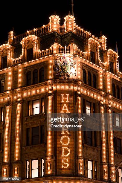 harrods department store name in lights - knightsbridge stock pictures, royalty-free photos & images