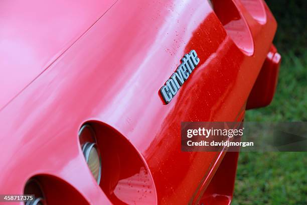 corvette front badge detail on red - chevrolet corvette stock pictures, royalty-free photos & images
