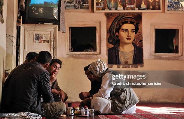 afghanistan men in traditional tchaikhana - afghanistan stock pictures, royalty-free photos & images