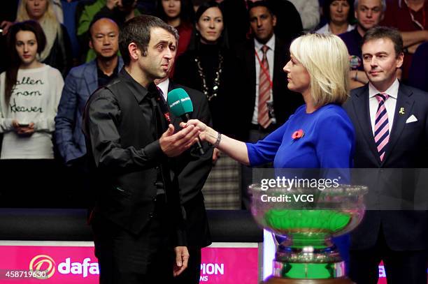 Ronnie O'Sullivan of England receives interview after winning the final match against Judd Trump of England on day six of the 2014 Dafabet Champion...