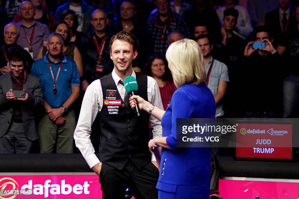 Judd Trump of England receives interview after the final match against Ronnie O'Sullivan of England on day six of the 2014 Dafabet Champion of...