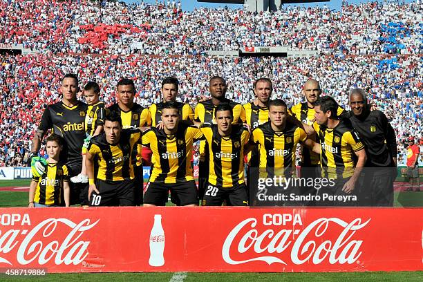 Players of Peñarol pose for a photo prior to a match between Nacional and Peñarol as part of round 12th of Campeonato Apertura 2014 at Centenario...