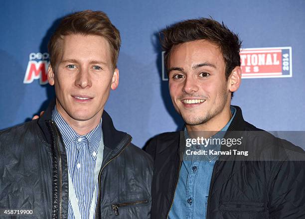 Dustin Lance Black and Tom Daley attend as the Dallas Cowboys play the Jacksonville Jaguars in an NFL match at Wembley Stadium on November 9, 2014 in...