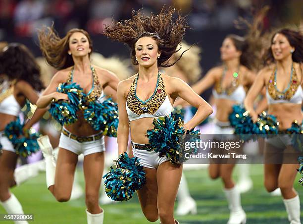 The Jacksonville Jaguars cheerleaders dance as the Dallas Cowboys play the Jacksonville Jaguars in an NFL match at Wembley Stadium on November 9,...