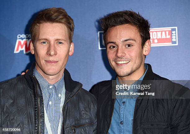Dustin Lance Black and Tom Daley attend as the Dallas Cowboys play the Jacksonville Jaguars in an NFL match at Wembley Stadium on November 9, 2014 in...