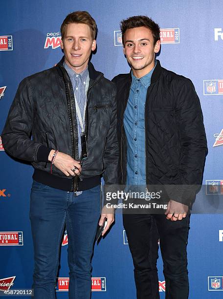 Dustin Lance Black and Tom Daley attend as the Dallas Cowboys play the Jacksonville Jaguars in an NFL match at Wembley Stadium on November 9, 2014 in...