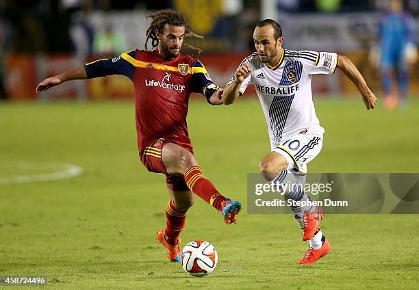 Landon Donovan of the Los Angeles Galaxy gets the ball past Kyle Beckerman of Real Salt Lake in Leg 2 of the Western Conference Semifinals at StubHub...