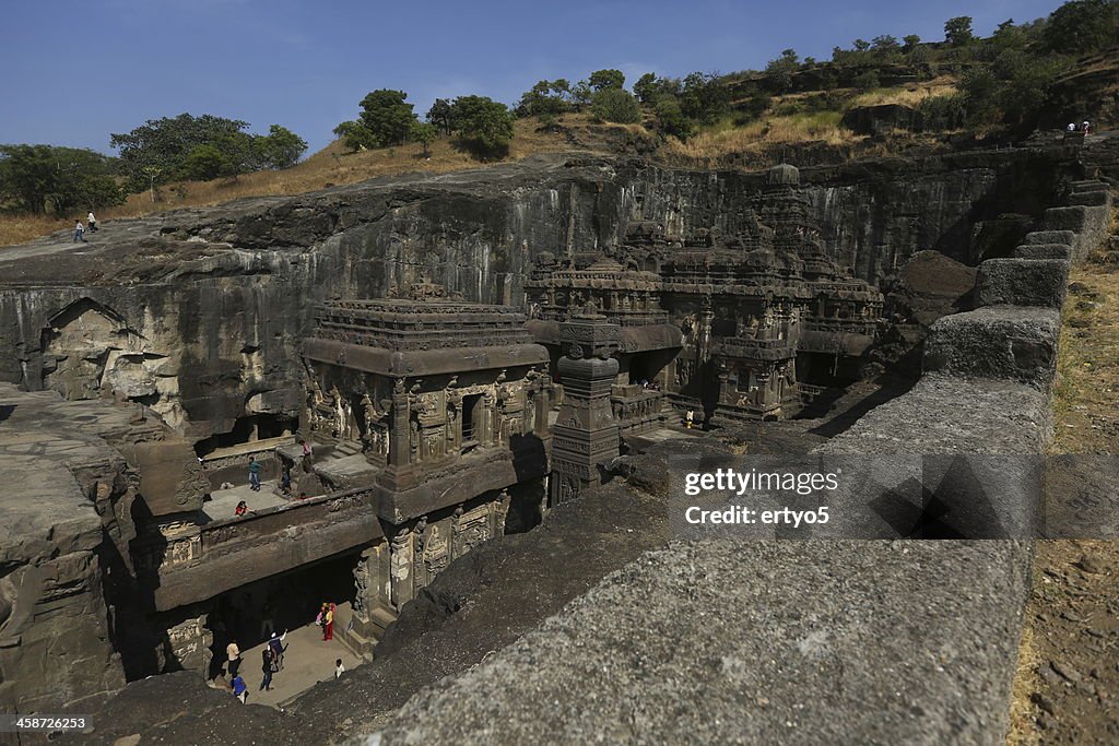 Tourists enjoy carvings at the Ellora Caves