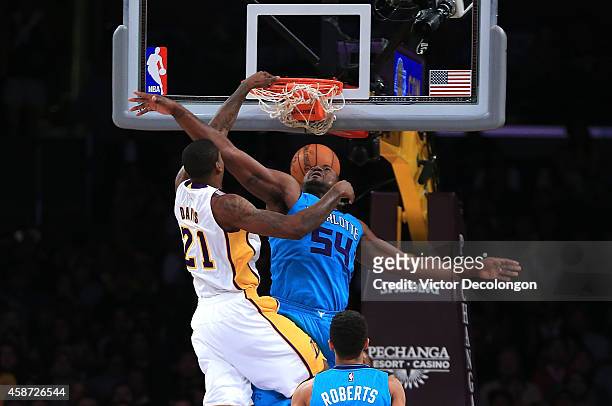 Ed Davis of the Los Angeles Lakers slam dunks against Jason Maxiell of the Charlotte Hornets in the first half during the NBA game at Staples Center...