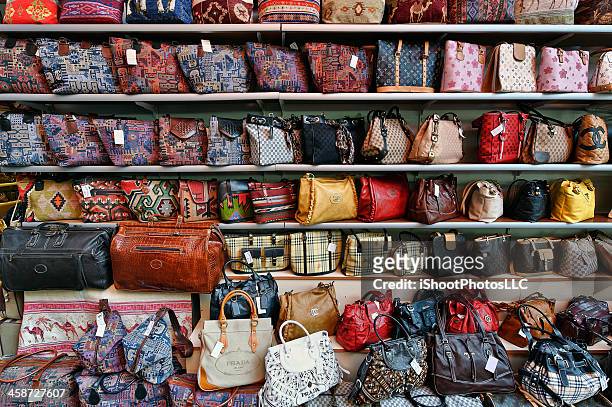 genuine fake designer hand bags - designer handbag stockfoto's en -beelden