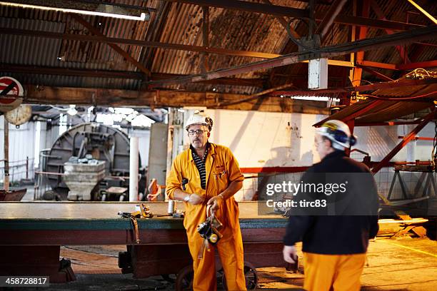 miner tour guide at the big pit colliery in blaenavon - coal mine stock pictures, royalty-free photos & images