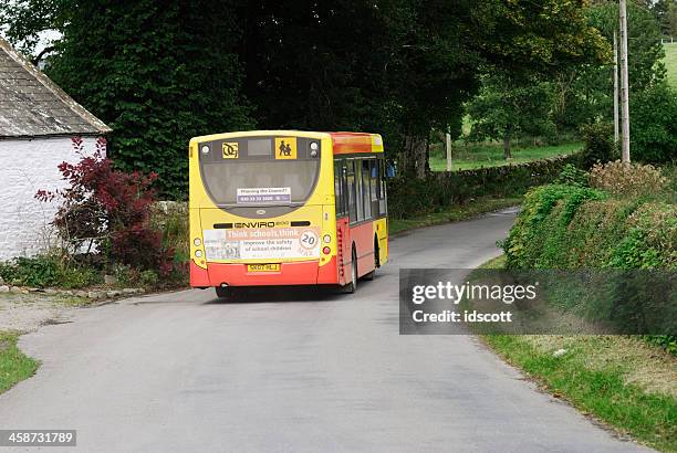 school bus on a scottish rural road - school bus stock pictures, royalty-free photos & images