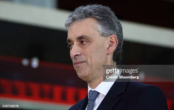 Frank Appel, chief executive officer of Deutsche Post AG, listens during a Bloomberg Television interview at the Asia-Pacific Economic Cooperation...