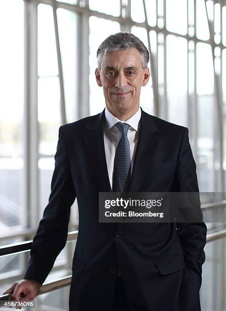 Frank Appel, chief executive officer of Deutsche Post AG, poses for a photograph after a Bloomberg Television interview at the Asia-Pacific Economic...