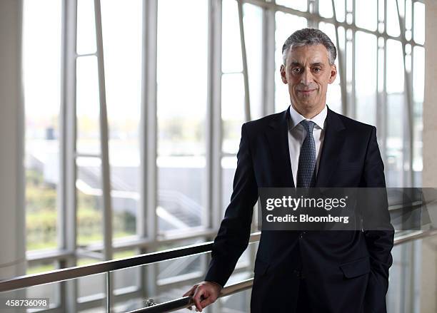 Frank Appel, chief executive officer of Deutsche Post AG, poses for a photograph after a Bloomberg Television interview at the Asia-Pacific Economic...