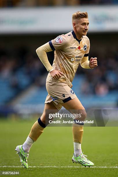 Lee Martin of Millwall plays in a special Remembrance Day commemorative camouflage kit during the Sky Bet Championship match between Millwall and...