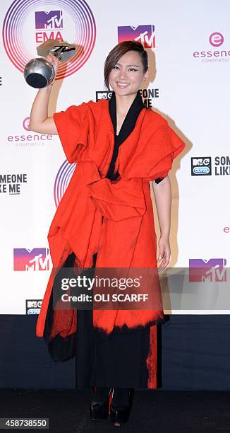 Chinese singer Bibi Zhou poses for pictures backstage after she was awarded the title of 'Best Worldwide Act' during the 2014 MTV Europe Music Awards...