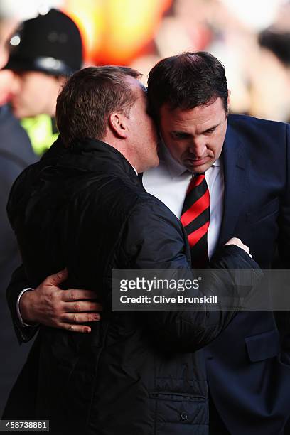 Cardiff City manager Malky Mackay talks with Liverpool manager Brendan Rogers before the Barclays Premier League match between Liverpool and Cardiff...