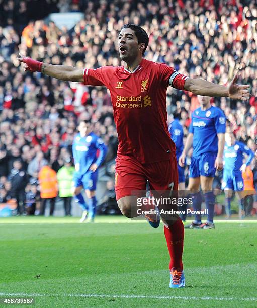 Luis Suarez of Liverpool celebrates the first goal during the Barclays Premier League match between Liverpool and Cardiff City at Anfield on December...