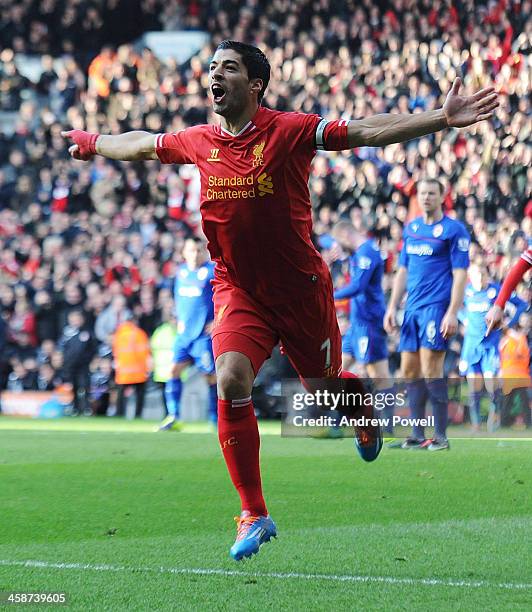 Luis Suarez of Liverpool celebrates the first goal during the Barclays Premier League match between Liverpool and Cardiff City at Anfield on December...