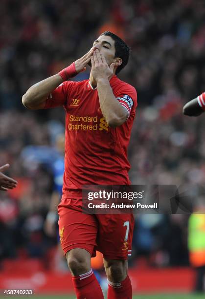 Luis Suarez of Liverpool celebrates during the Barclays Premier League match between Liverpool and Cardiff City at Anfield on December 21, 2013 in...