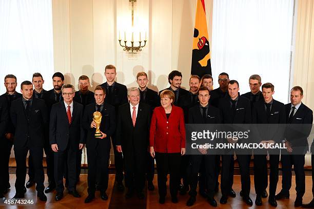 Players and team members of the German football national team who took part in the 2014 FIFA Football World Cup and German politicians Germany's...