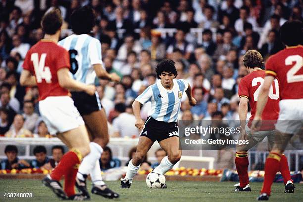 Argentina player Diego Maradona takes on the Belguim defence during the 1982 FIFA World Cup match between Argentina and Belguim at the Nou Camp...
