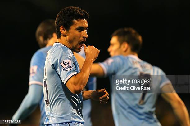 Jesus Navas of Manchester City celebrates scoring their third goal during the Barclays Premier League match between Fulham and Manchester City at...