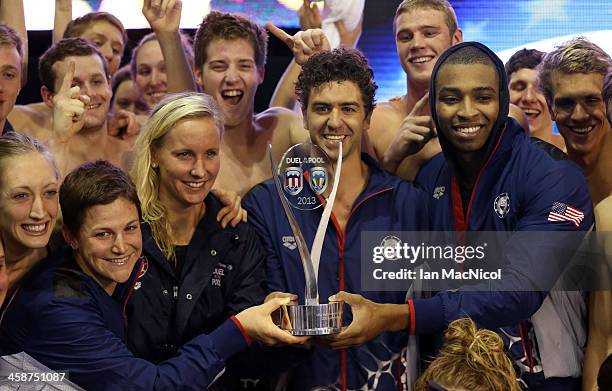 Team USA's Anthony Ervin , Jessica Hardy and Cullen Jones pose with the trophy after victory during Day Two of Duel In The Pool at Tollcross...