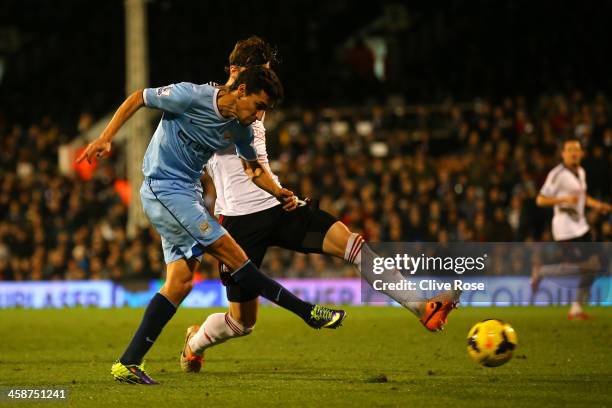 Jesus Navas of Manchester City scores the third goal during the Barclays Premier League match between Fulham and Manchester City at Craven Cottage on...