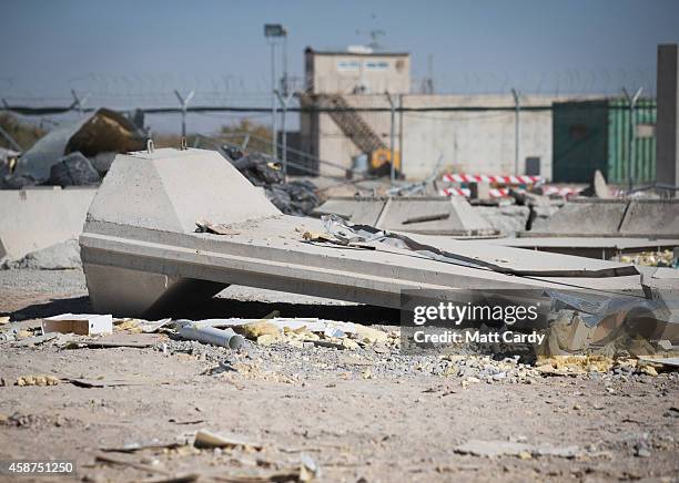 Sections of concrete blast walls that have been removed lie in a compound at Kandahar airfield on November 10, 2014 in Kandahar, Afghanistan. Now...