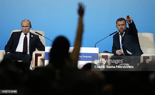 Russian President Vladimir Putin and billionaire Oleg Deripaska speak during a APEC Leaders meeting on November 10, 2014 in Beijing, China. The APEC...