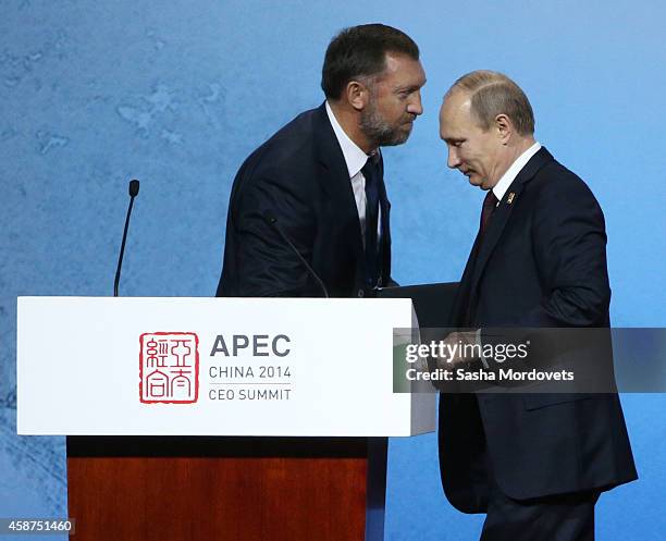 Russian President Vladimir Putin and billionaire Oleg Deripaska attend a APEC Leaders meeting on November 10, 2014 in Beijing, China. The APEC Summit...