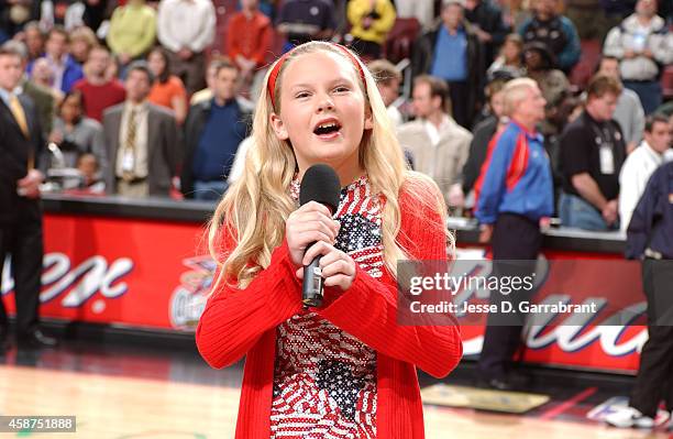 Performer Taylor Swift sings the National Anthem prior to the game of the Detroit Pistons against the Philadelphia 76ers on April 5, 2002 at the...