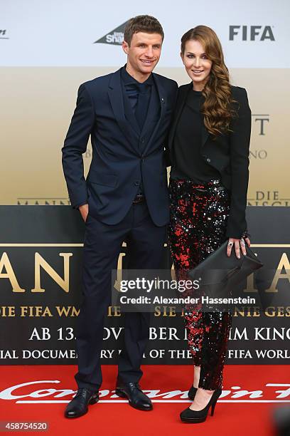 Thomas Mueller of the German national football team arrives with his wife Lisa Mueller for the movie premiere 'Die Mannschaft' at Sony Center Berlin...