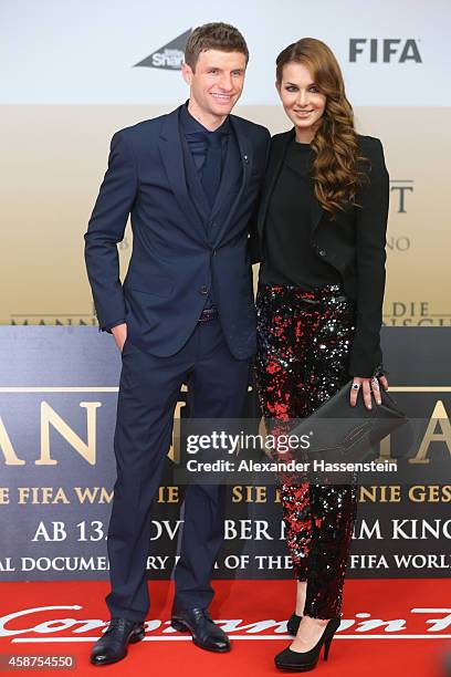 Thomas Mueller of the German national football team arrives with his wife Lisa Mueller for the movie premiere 'Die Mannschaft' at Sony Center Berlin...