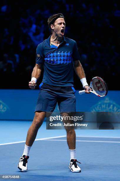 Robert Lindstedt of Sweden with Lukasz Kubot of Poland celebrates their win over Bob and Mike Bryan of USA in the round robin doubles during day two...