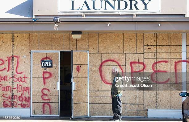 Plywood covers the glass front of the Ferguson Laundry, located in a strip mall along West Florissant Street, on November 10, 2014 in Ferguson,...