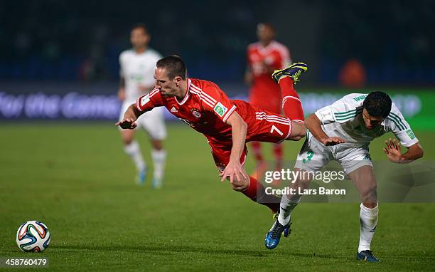 Franck Ribery of Muenchen is challenged by Zakaria El Hachimi of Casablanca during the FIFA Club World Cup Final between FC Bayern Muenchen and Raja...