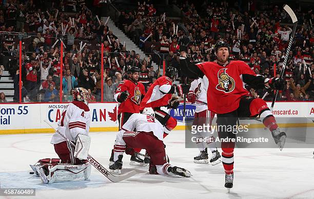 Marc Methot of the Ottawa Senators celebrates his first period power-play goal against Mike Smith and Connor Murphy of the Phoenix Coyotes with...